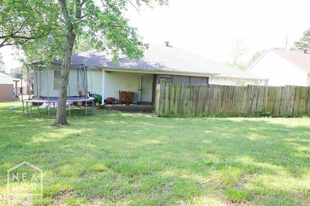 5703 Cedar St, Paragould, AR 72450 - view of yard with a trampoline