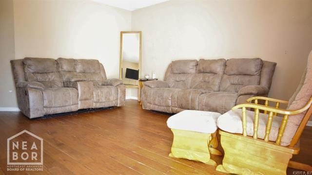 5703 Cedar St, Paragould, AR 72450 - living area featuring wood finished floors and baseboards