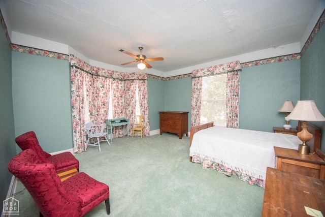 bedroom featuring baseboards, a ceiling fan, and carpet floors