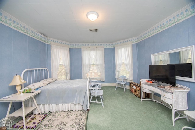 carpeted bedroom with ornamental molding, visible vents, and multiple windows