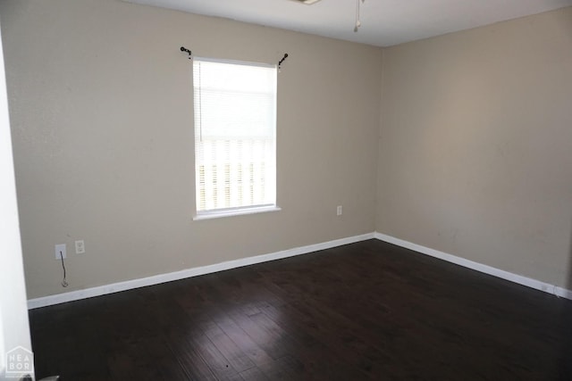 501 E Allen Dr, Jonesboro, AR 72401 - empty room with dark wood-style floors, baseboards, and a ceiling fan