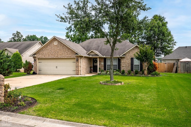 321 Crestfield Dr, Jonesboro, AR 72404 - view of front of house featuring an attached garage, brick siding, driveway, and roof with shingles