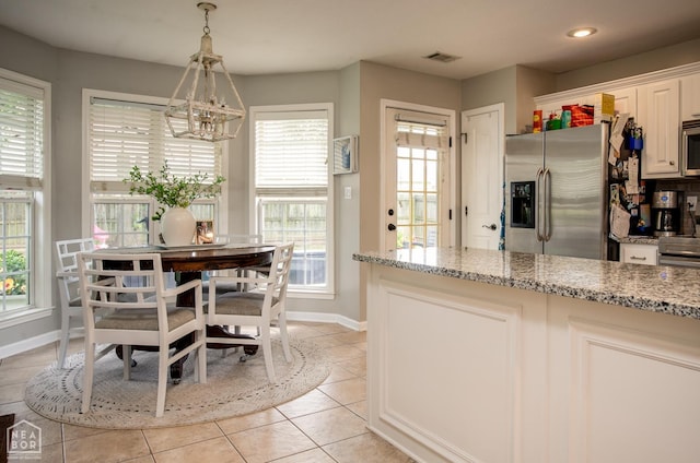321 Crestfield Dr, Jonesboro, AR 72404 - dining area with healthy amount of natural light, light tile patterned floors, and recessed lighting