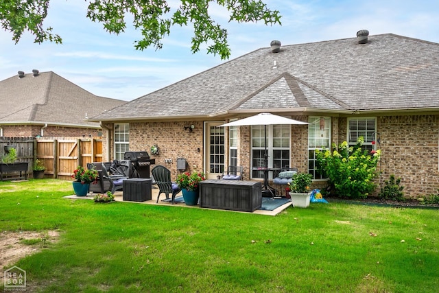 321 Crestfield Dr, Jonesboro, AR 72404 - rear view of property with brick siding, an outdoor hangout area, and a shingled roof