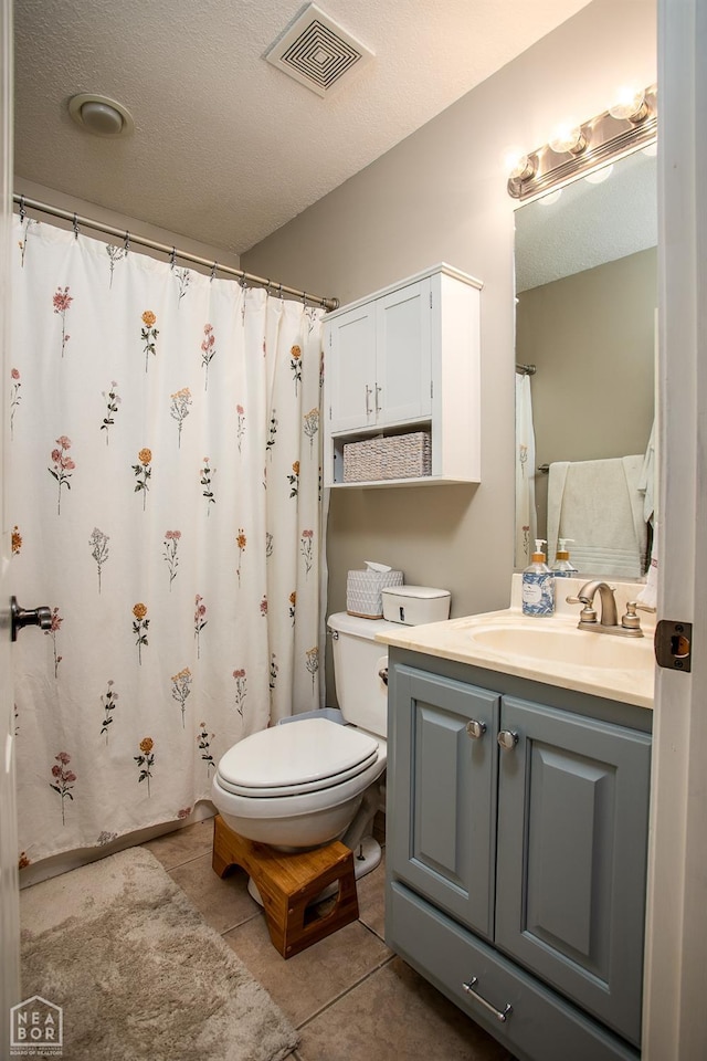 321 Crestfield Dr, Jonesboro, AR 72404 - bathroom with vanity, tile patterned floors, a shower with shower curtain, and a textured ceiling