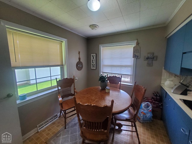 691 Crestline Dr, Piggott, AR 72454 - dining space featuring plenty of natural light and crown molding