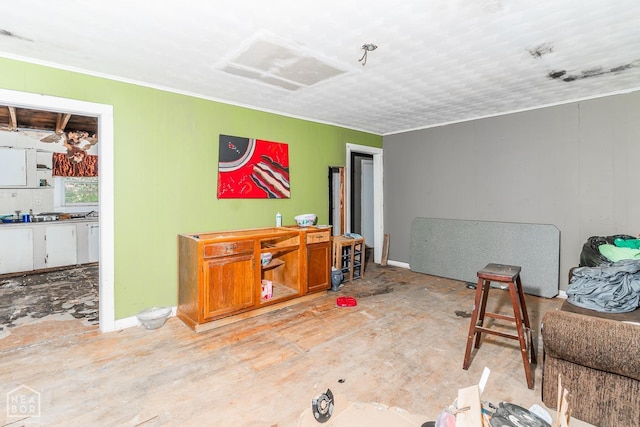 living area featuring ornamental molding
