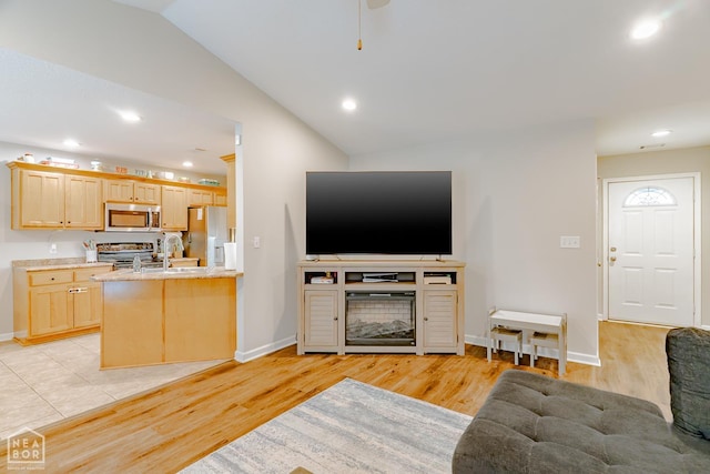 1409 Hemingway Cir, Jonesboro, AR 72405 - living room featuring lofted ceiling, light wood-type flooring, baseboards, and recessed lighting