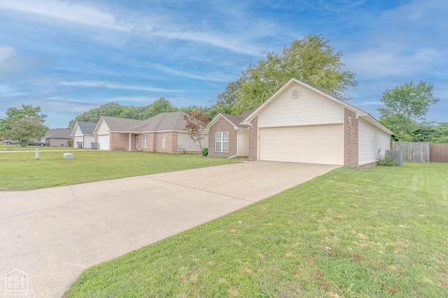 1409 Hemingway Cir, Jonesboro, AR 72405 - single story home with brick siding, concrete driveway, and a garage