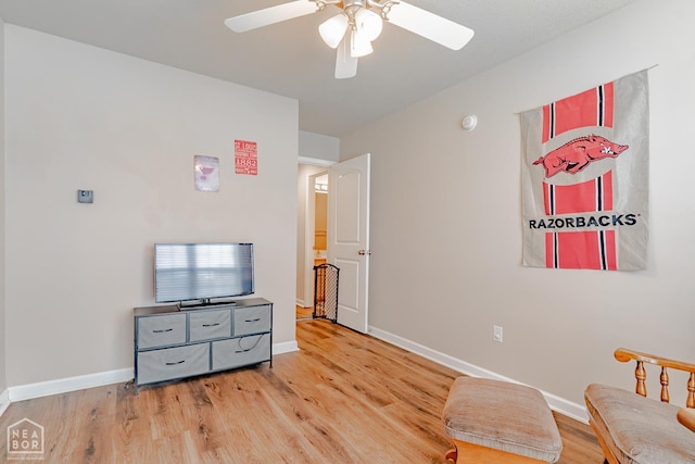 1409 Hemingway Cir, Jonesboro, AR 72405 - sitting room with a ceiling fan, baseboards, and light wood-style floors
