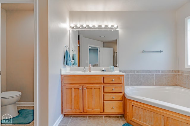 1409 Hemingway Cir, Jonesboro, AR 72405 - full bath featuring a garden tub, vanity, toilet, and tile patterned flooring