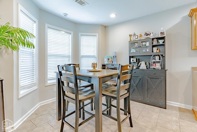 1409 Hemingway Cir, Jonesboro, AR 72405 - dining space with light tile patterned floors, baseboards, and recessed lighting