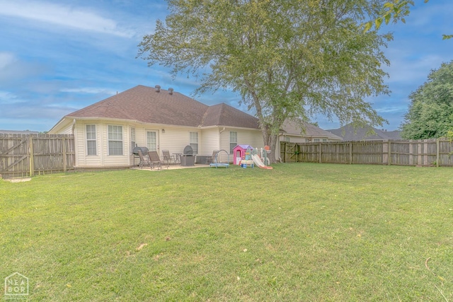 1409 Hemingway Cir, Jonesboro, AR 72405 - rear view of property featuring a patio area and a playground