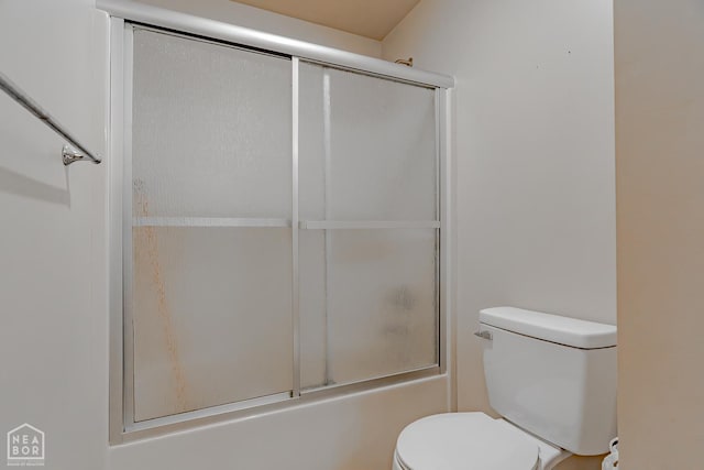 1409 Hemingway Cir, Jonesboro, AR 72405 - bathroom with toilet and shower / bath combination with glass door