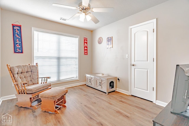 1409 Hemingway Cir, Jonesboro, AR 72405 - sitting room with light wood-style floors, ceiling fan, and baseboards