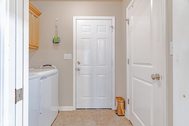 1409 Hemingway Cir, Jonesboro, AR 72405 - washroom featuring cabinet space, independent washer and dryer, light tile patterned floors, and baseboards