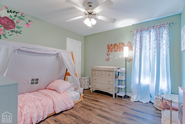 1409 Hemingway Cir, Jonesboro, AR 72405 - bedroom with wood finished floors and ceiling fan