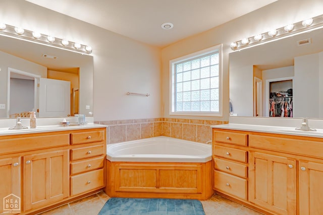1409 Hemingway Cir, Jonesboro, AR 72405 - full bathroom with tile patterned floors, vanity, a bath, and a spacious closet