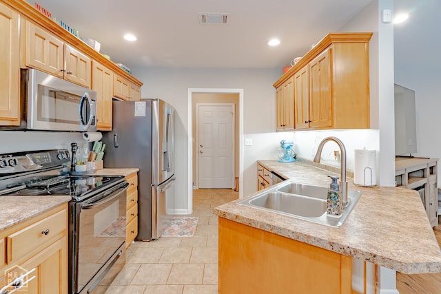 1409 Hemingway Cir, Jonesboro, AR 72405 - kitchen with appliances with stainless steel finishes, a sink, light brown cabinets, a peninsula, and light countertops