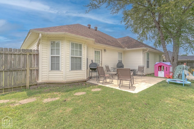 1409 Hemingway Cir, Jonesboro, AR 72405 - back of house with a patio area and a shingled roof