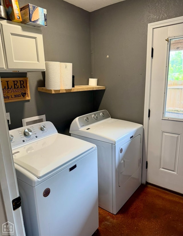 415 NW 3rd St, Walnut Ridge, AR 72476 - laundry area featuring washing machine and dryer and cabinet space
