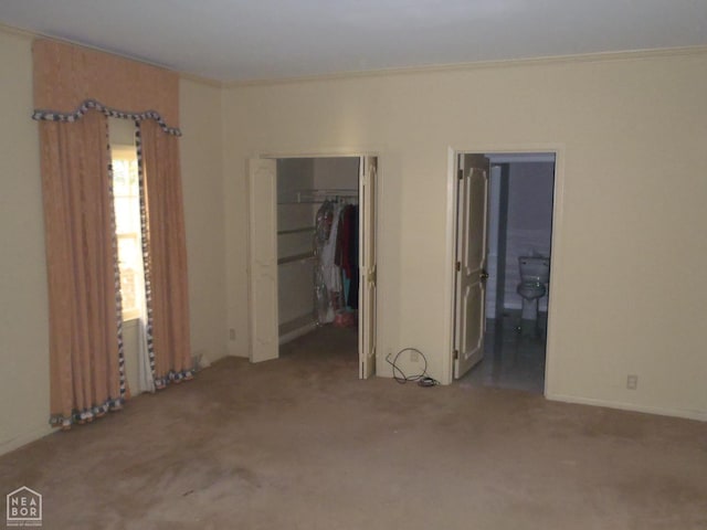 4 Virginia Rd, Newport, AR 72112 - unfurnished bedroom featuring carpet, a spacious closet, a closet, connected bathroom, and ornamental molding