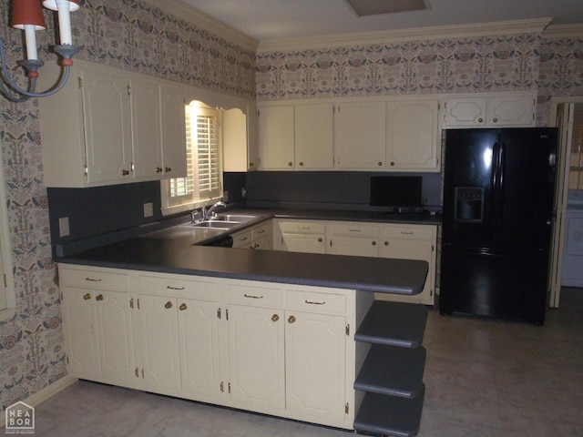 4 Virginia Rd, Newport, AR 72112 - kitchen featuring black fridge with ice dispenser, wallpapered walls, dark countertops, crown molding, and white cabinets