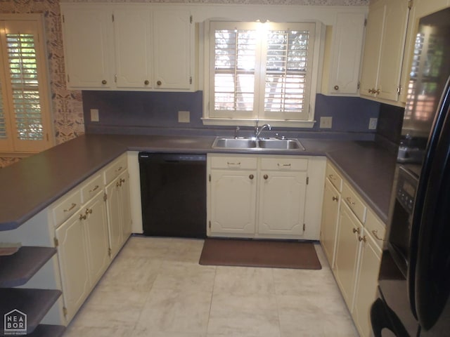 4 Virginia Rd, Newport, AR 72112 - kitchen featuring black appliances, a peninsula, and white cabinetry