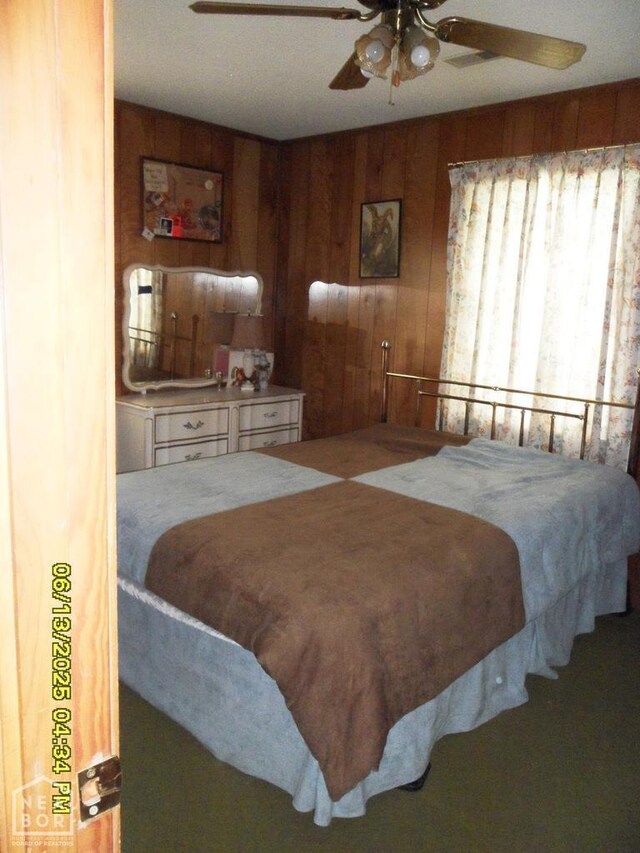 2805 Robinson St, Newport, AR 72112 - bedroom featuring wooden walls and a ceiling fan