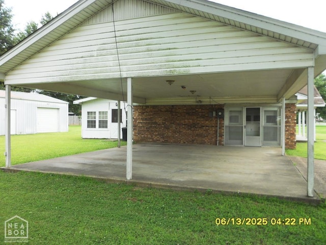 2805 Robinson St, Newport, AR 72112 - view of patio featuring an outdoor structure and a carport