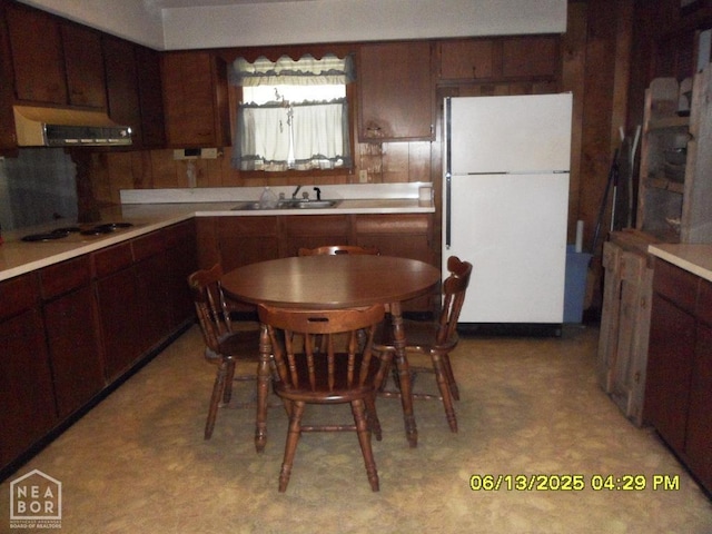 2805 Robinson St, Newport, AR 72112 - kitchen featuring white appliances, exhaust hood, light flooring, and light countertops