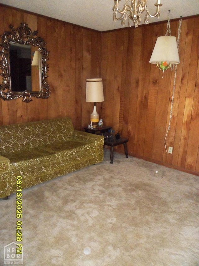 2805 Robinson St, Newport, AR 72112 - carpeted living room featuring a chandelier and wood walls