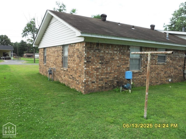 2805 Robinson St, Newport, AR 72112 - view of home's exterior with brick siding and a lawn