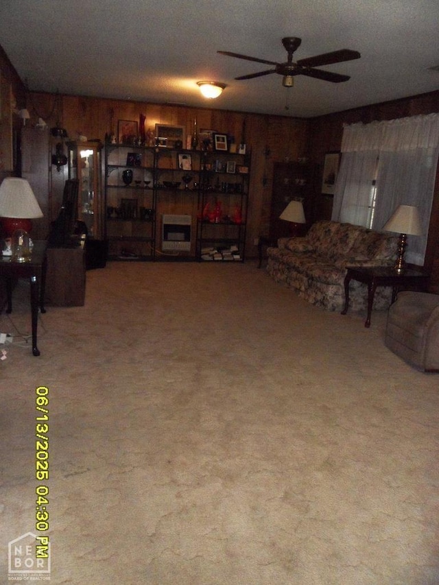 2805 Robinson St, Newport, AR 72112 - living area with ceiling fan, carpet floors, and wood walls