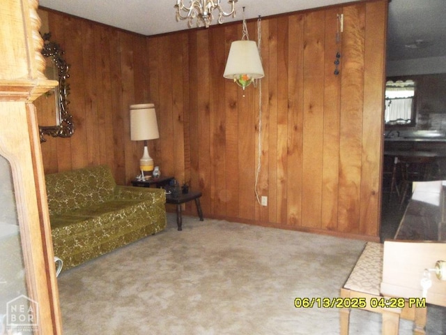 2805 Robinson St, Newport, AR 72112 - living room featuring wooden walls, a chandelier, and carpet flooring