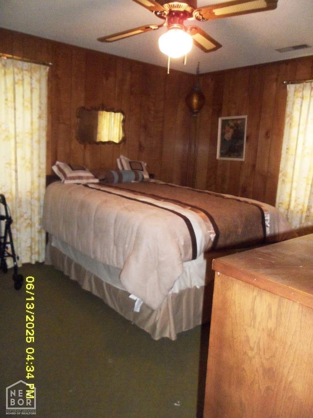 2805 Robinson St, Newport, AR 72112 - bedroom with wood walls and ceiling fan