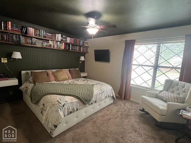 bedroom featuring baseboards, ceiling fan, and carpet