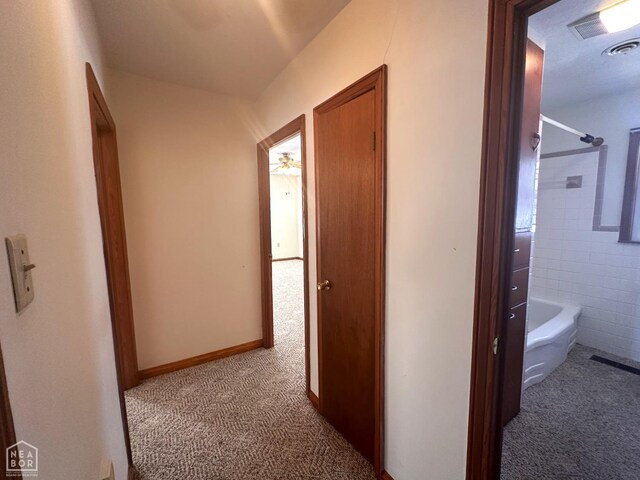 245 S 18th St, Piggott, AR 72454 - hall with carpet floors and visible vents