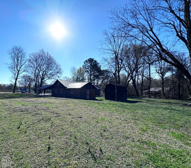 245 S 18th St, Piggott, AR 72454 - snow covered house featuring brick siding and crawl space