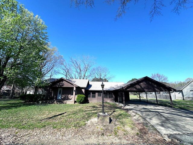 245 S 18th St, Piggott, AR 72454 - view of snowy yard