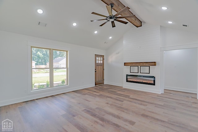 400 Gia St, Bono, AR 72416 - unfurnished living room featuring beamed ceiling, a large fireplace, high vaulted ceiling, ceiling fan, and healthy amount of natural light