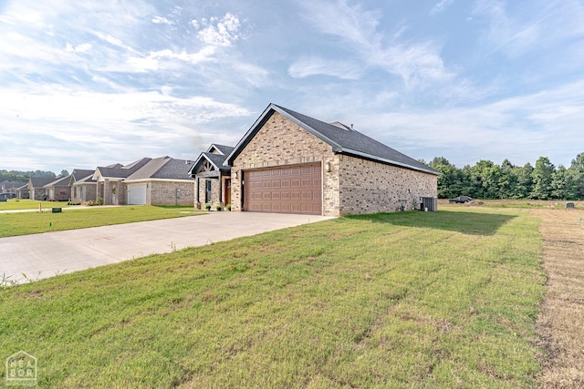 400 Gia St, Bono, AR 72416 - view of home's exterior with driveway, brick siding, a yard, and an attached garage