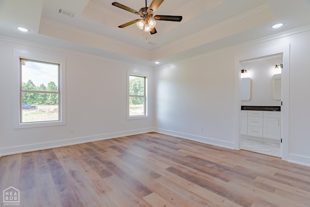 400 Gia St, Bono, AR 72416 - unfurnished room with crown molding, light wood-style floors, a raised ceiling, a ceiling fan, and recessed lighting