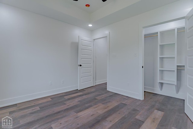 400 Gia St, Bono, AR 72416 - unfurnished bedroom featuring wood finished floors, recessed lighting, and a tray ceiling