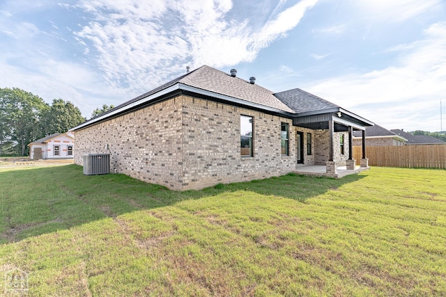400 Gia St, Bono, AR 72416 - back of property with a patio, a shingled roof, and brick siding