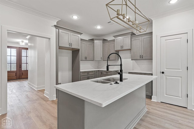 3424 Hudson Dr, Jonesboro, AR 72405 - kitchen with a sink, gray cabinets, light wood-type flooring, and ornamental molding