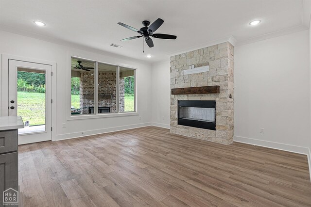 3424 Hudson Dr, Jonesboro, AR 72405 - unfurnished living room featuring visible vents, baseboards, ornamental molding, ceiling fan, and wood finished floors