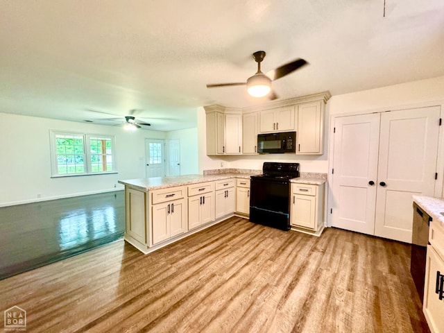 1005 W Lake St, Manila, AR 72442 - kitchen with black appliances, ceiling fan, a peninsula, light wood-style floors, and light stone countertops
