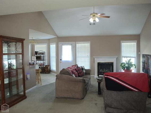 3300 Jeridon Cv, Jonesboro, AR 72404 - living room featuring a fireplace, plenty of natural light, a ceiling fan, carpet flooring, and high vaulted ceiling