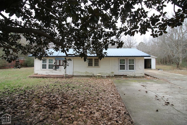 261 Greene Road 507, Lafe, AR 72436 - view of front facade with concrete driveway and metal roof